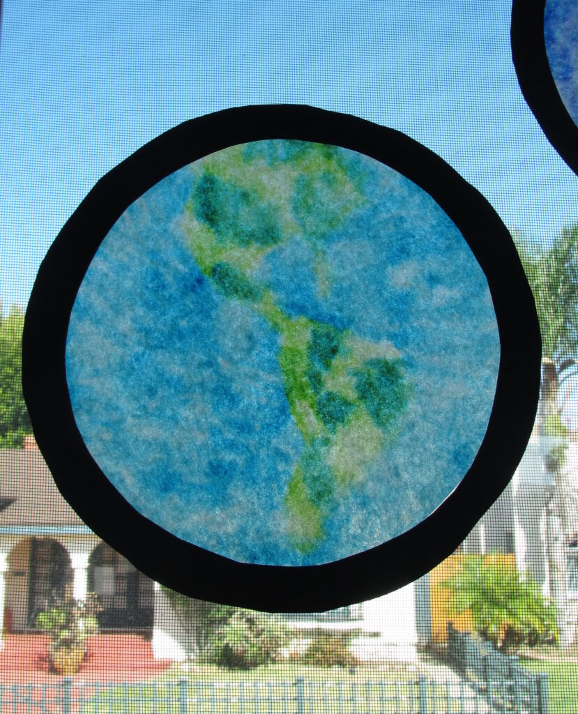 Earth Day Coffee Filter Craft hanging in classroom window